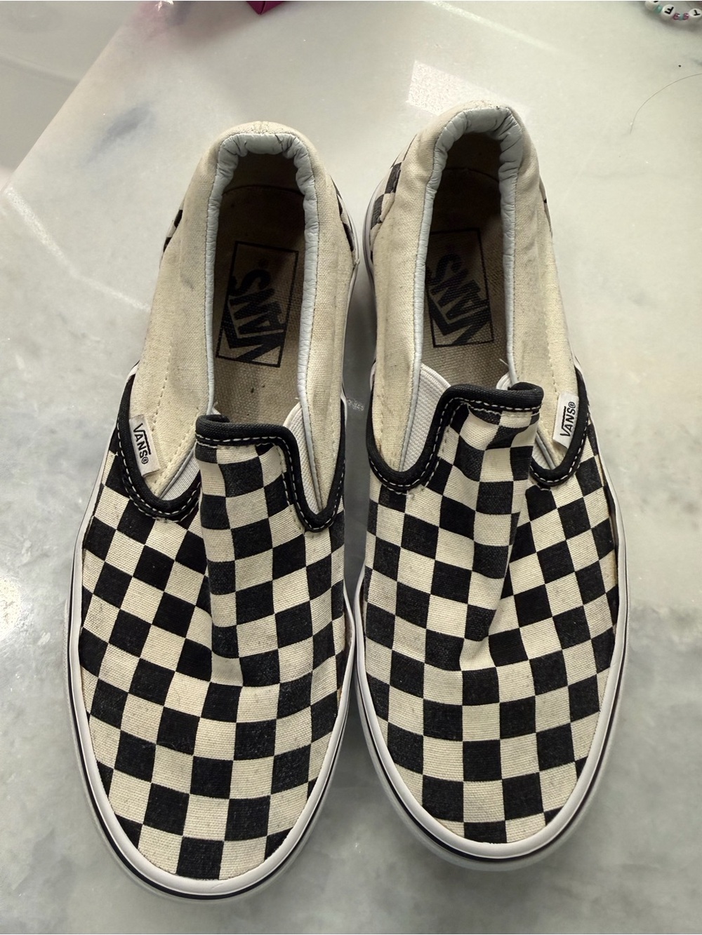 Vans womens Checkerboard Slip-On Sneakers - Black & White